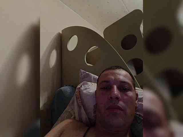 Artem (33, White Cam Boy) performing blowjob.